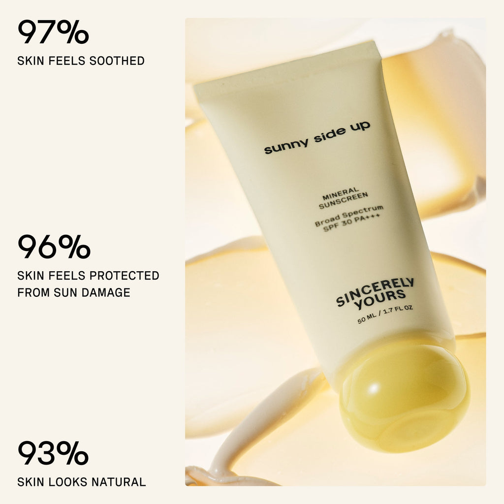 Sunny Side Up sunscreen tube with text indicating skin benefits on a light background
