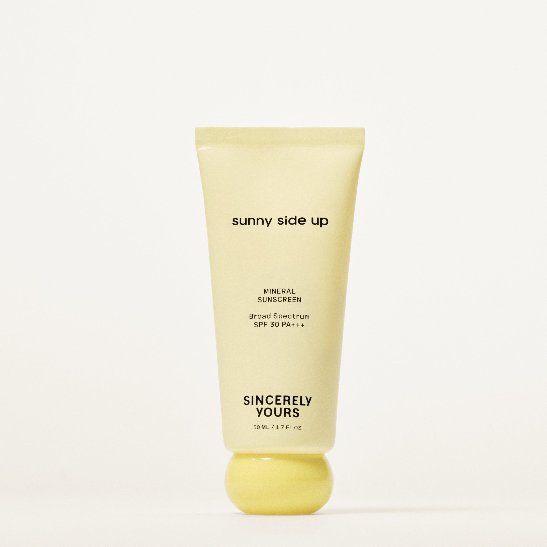 Tube of 'sunny side up' sunscreen on a white background